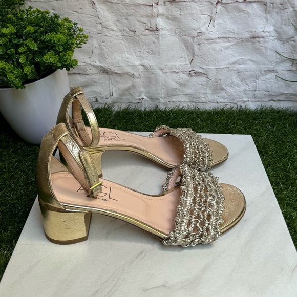 AGL
Crochet Penny Block Heel Sandal in Golden Platino color size 36.5 US 6.5 - Picture 11 of 14
